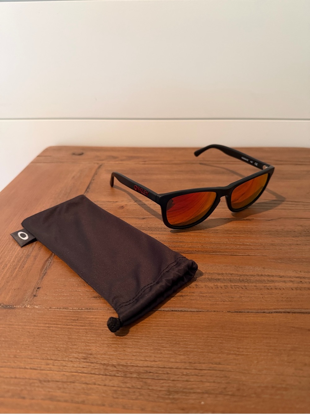 NWOTs Oakley Black Frame Sunglasses with Orange-Red Mirrored Lenses